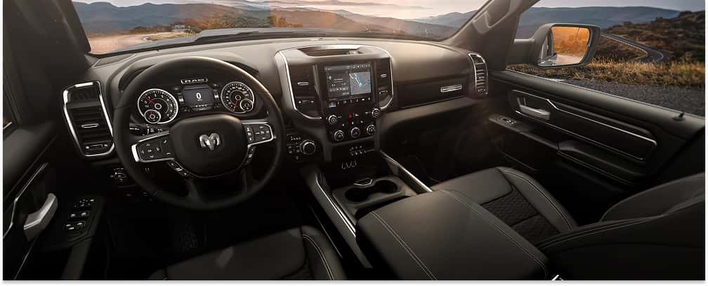 Black interior cabin and dashboard layout of a 2026 RAM 1500 truck.