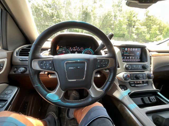 Interior of 2018 Yukon Denali showing leather seats and premium infotainment system
