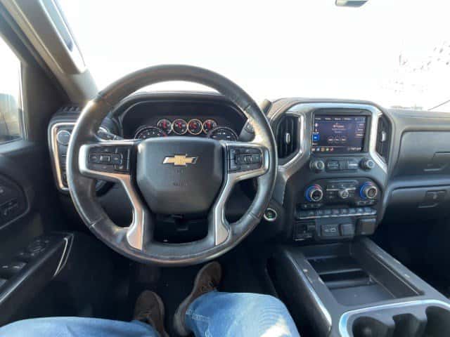Side and rear angle of used Silverado LTZ 2020 near Conroe Texas with 4x4