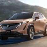 Nissan ARIYA driving on a mountain road