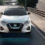 Pearl White 2022 Nissan Maxima on a city street_mobile