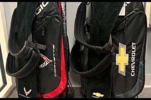 Chevrolet and Corvette branded golf bags in red and black on display at Bill Kay Chevrolet Pro Shop