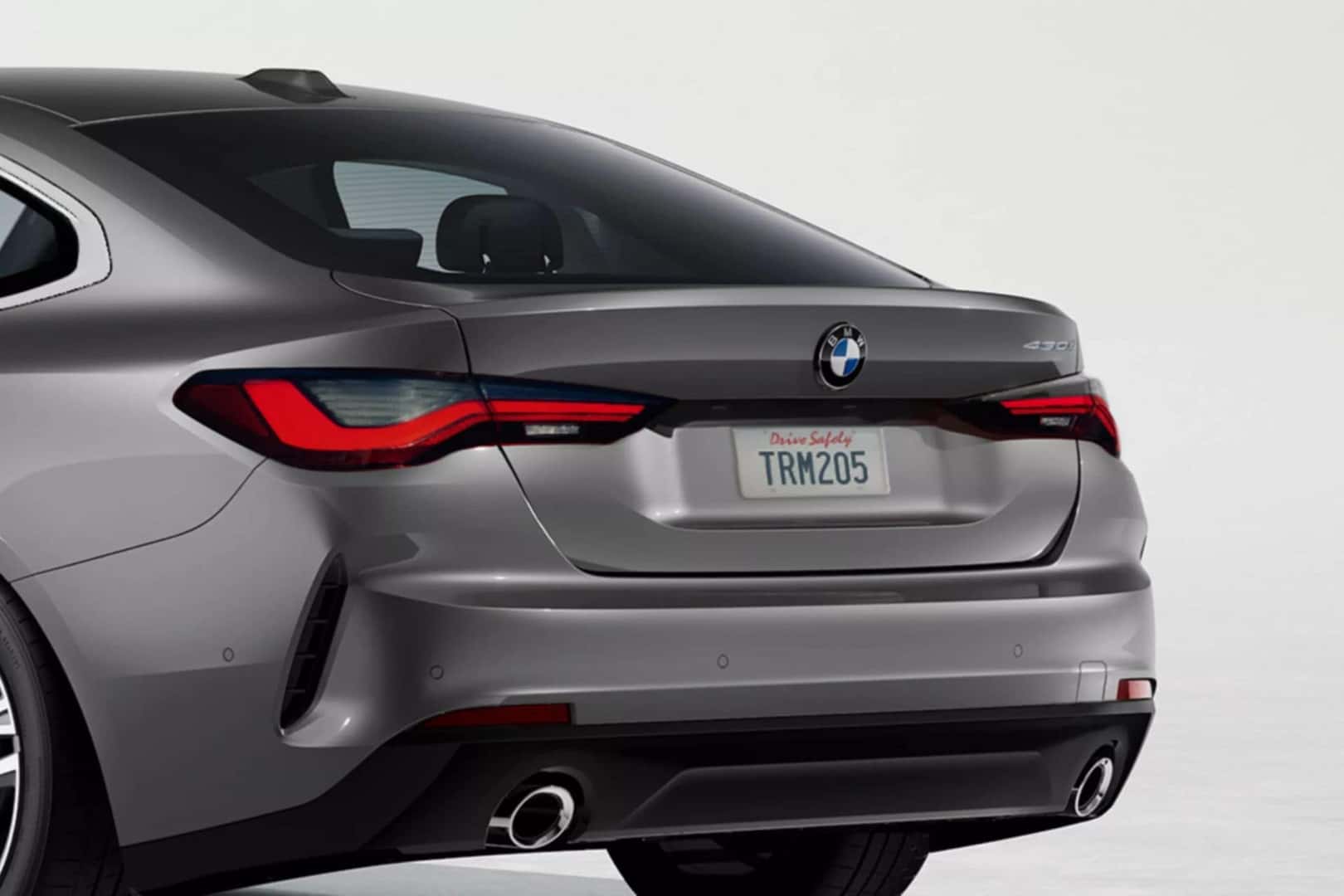 rear view of a bmw 4 series grand coupe, emphasizing the aerodynamic styling and exhaust system