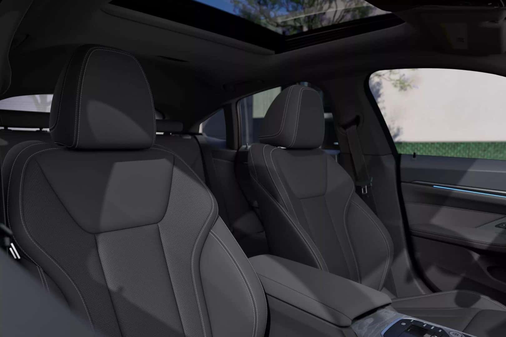 Interior of a BMW 4 series grand coupe featureing spacious seats and a panoramic sunroof