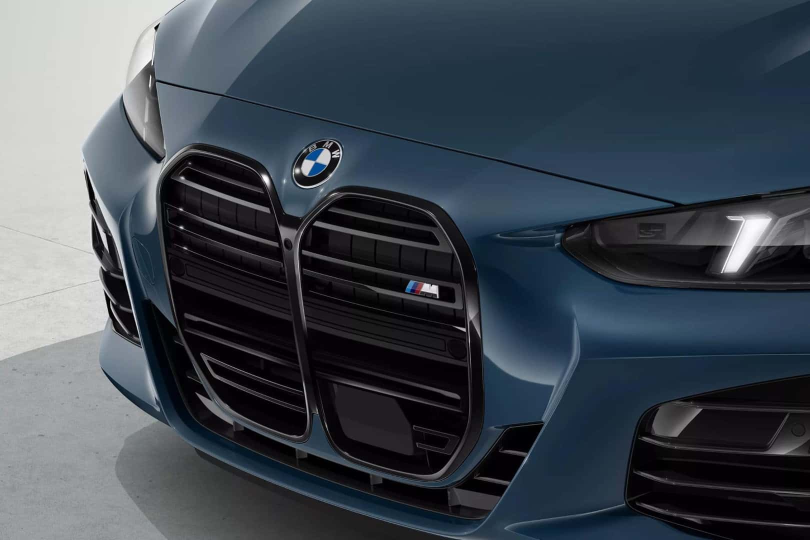 Close-up of the BMW 4 Series convertible in blue, featuring the bold kidney grille and LED headlights.