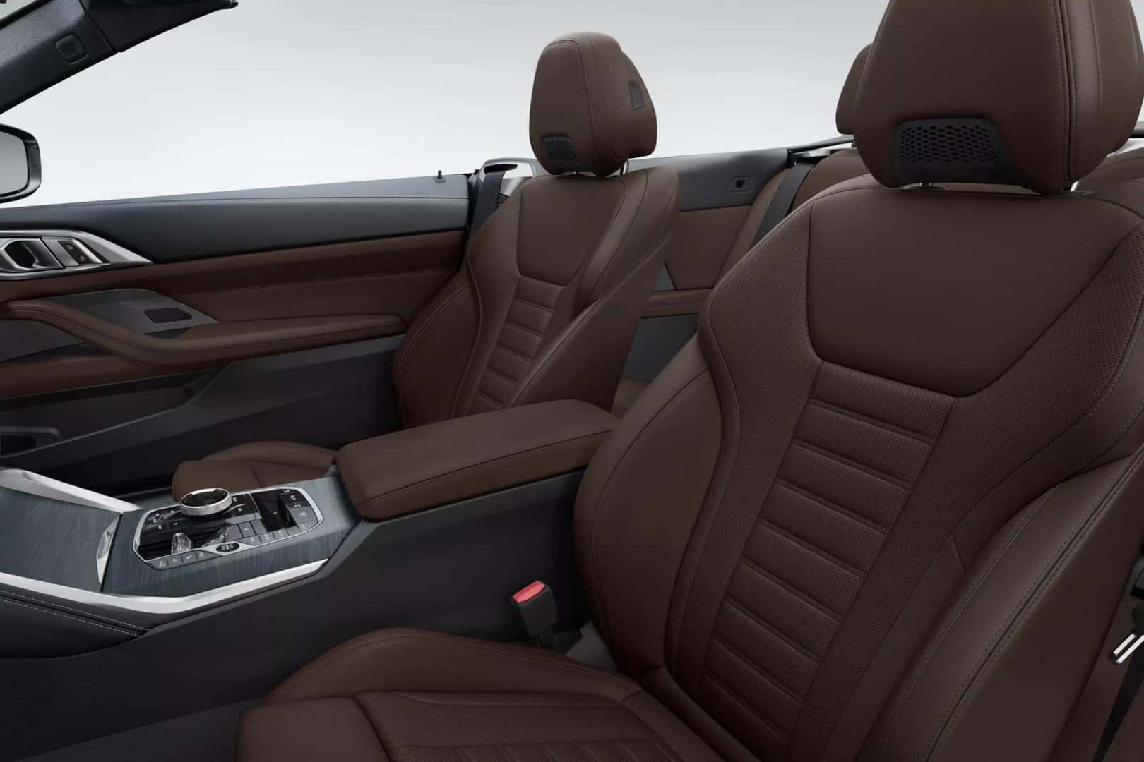 Front seats of the BMW 4 Series convertible with premium brown leather upholstery.