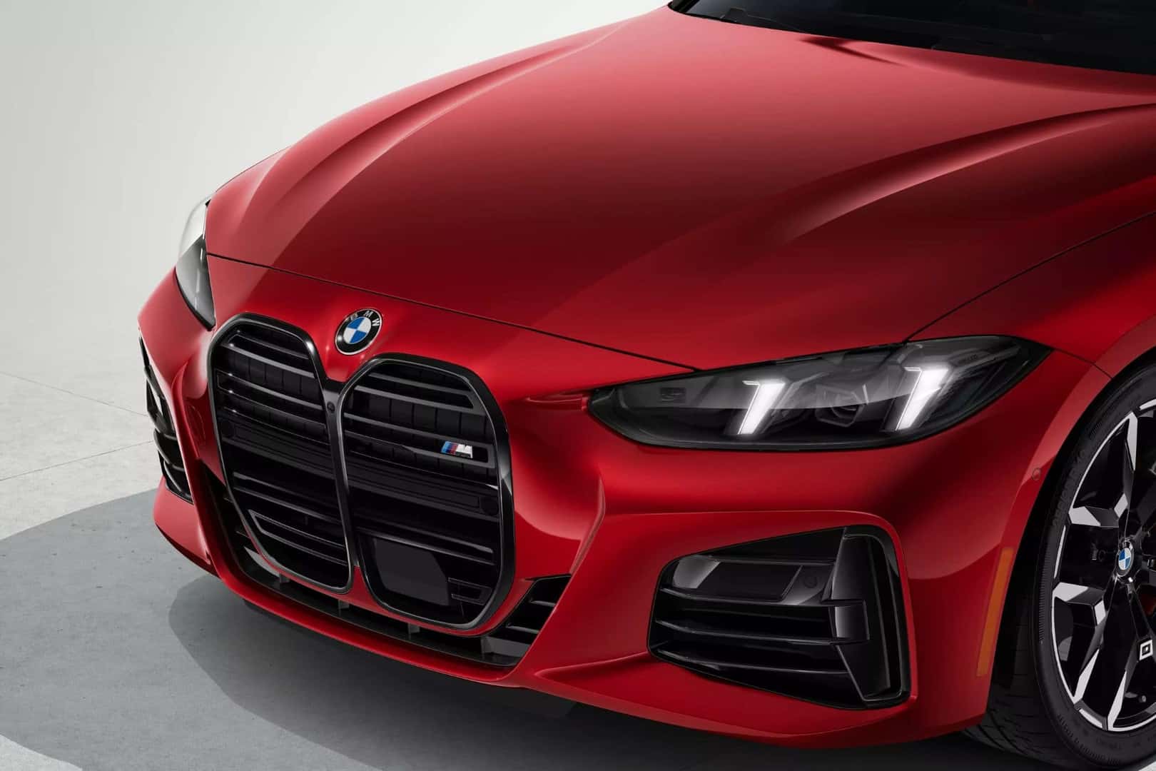 front fiew of the bmw 4 series coupe in red finish, showcasing the kidney grille and headlights