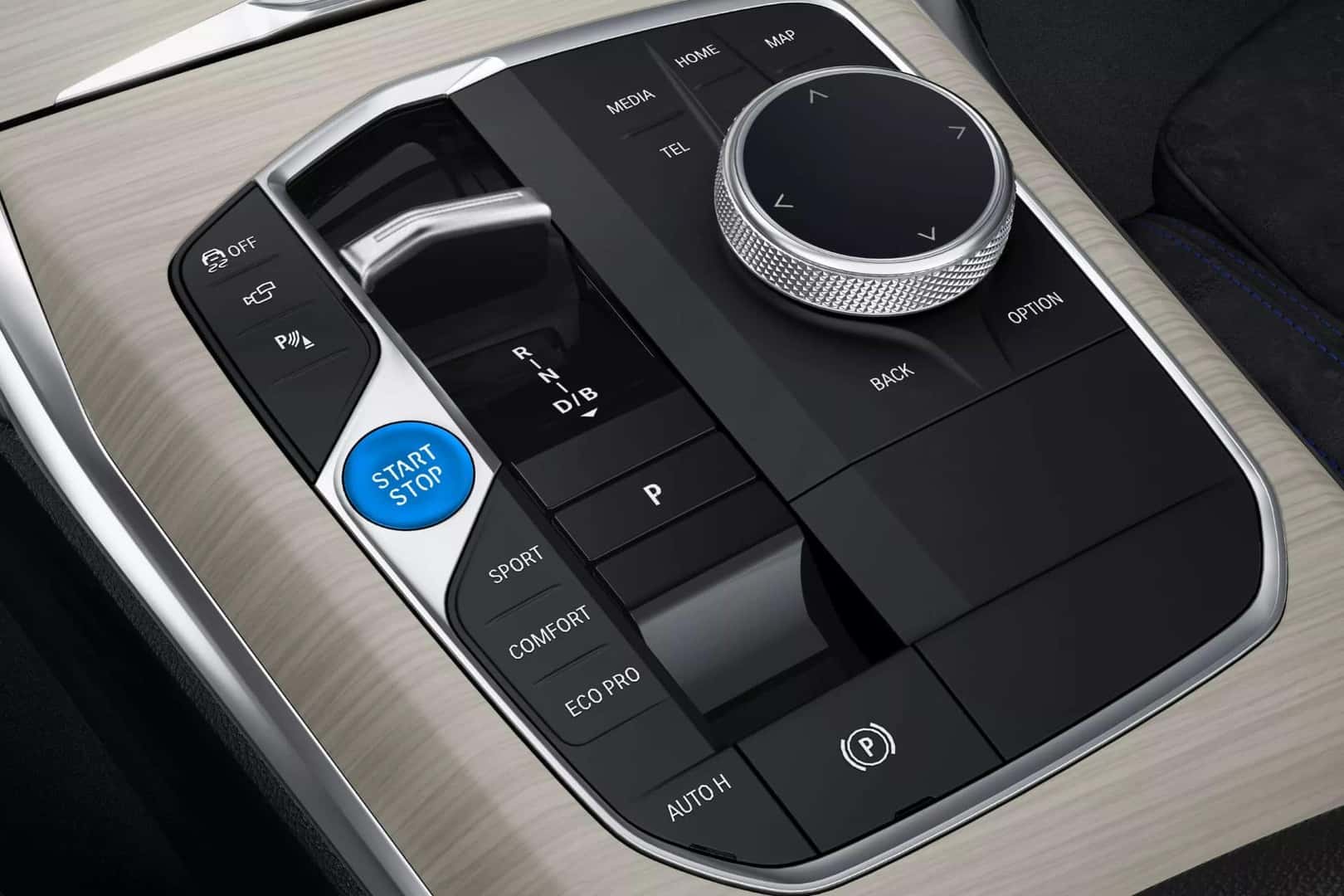 Close-up of the BMW i4 center console with a start/stop button and advanced driving mode controls.