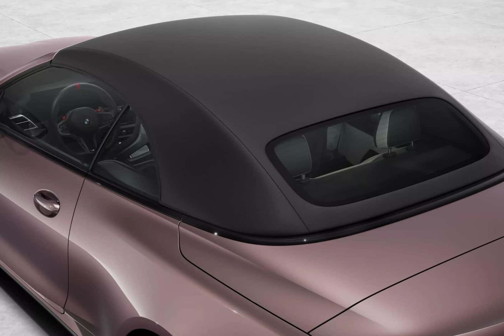 BMW M4 convertible with the soft top closed, showing a sleek and stylish roof design.