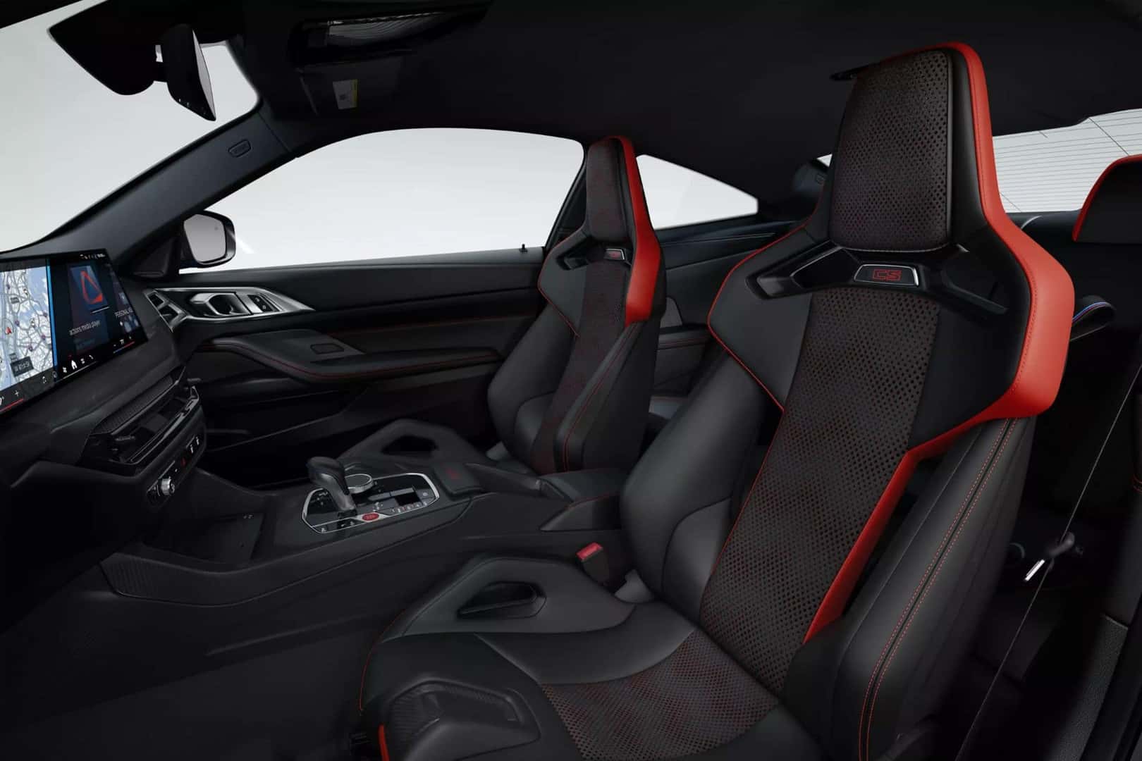 Interior of the BMW M4 coupe with black and red sport seats, designed for maximum comfort and style.