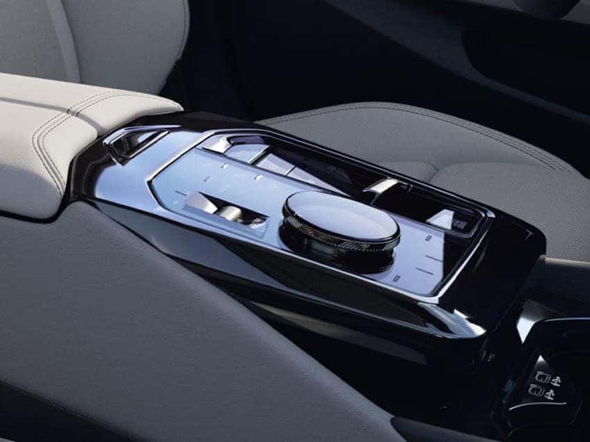BMW iDrive controller with touch-sensitive panel on the center console.