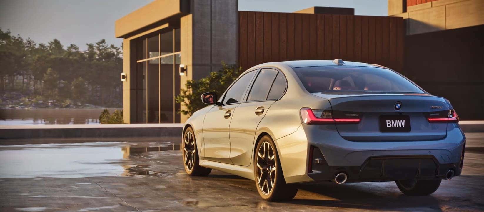 2025 BMW 3 Series 330i model in a modern setting with sleek rear styling.