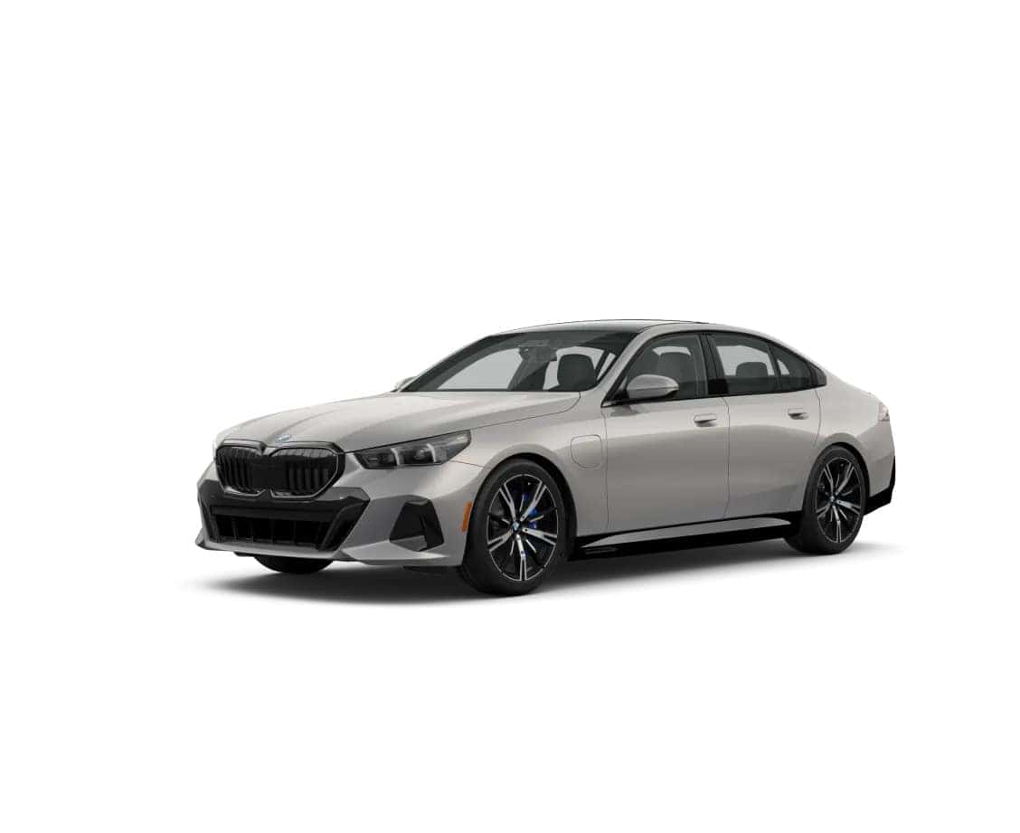 2025 BMW 550e xDrive Plug-in Hybrid in silver shown from front-side angle on a white background