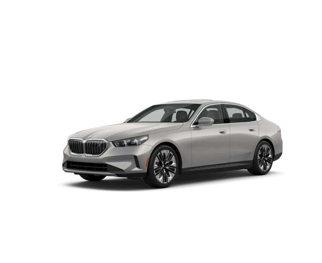 2025 BMW i5 electric sedan in silver shown from a front-side angle on a white background