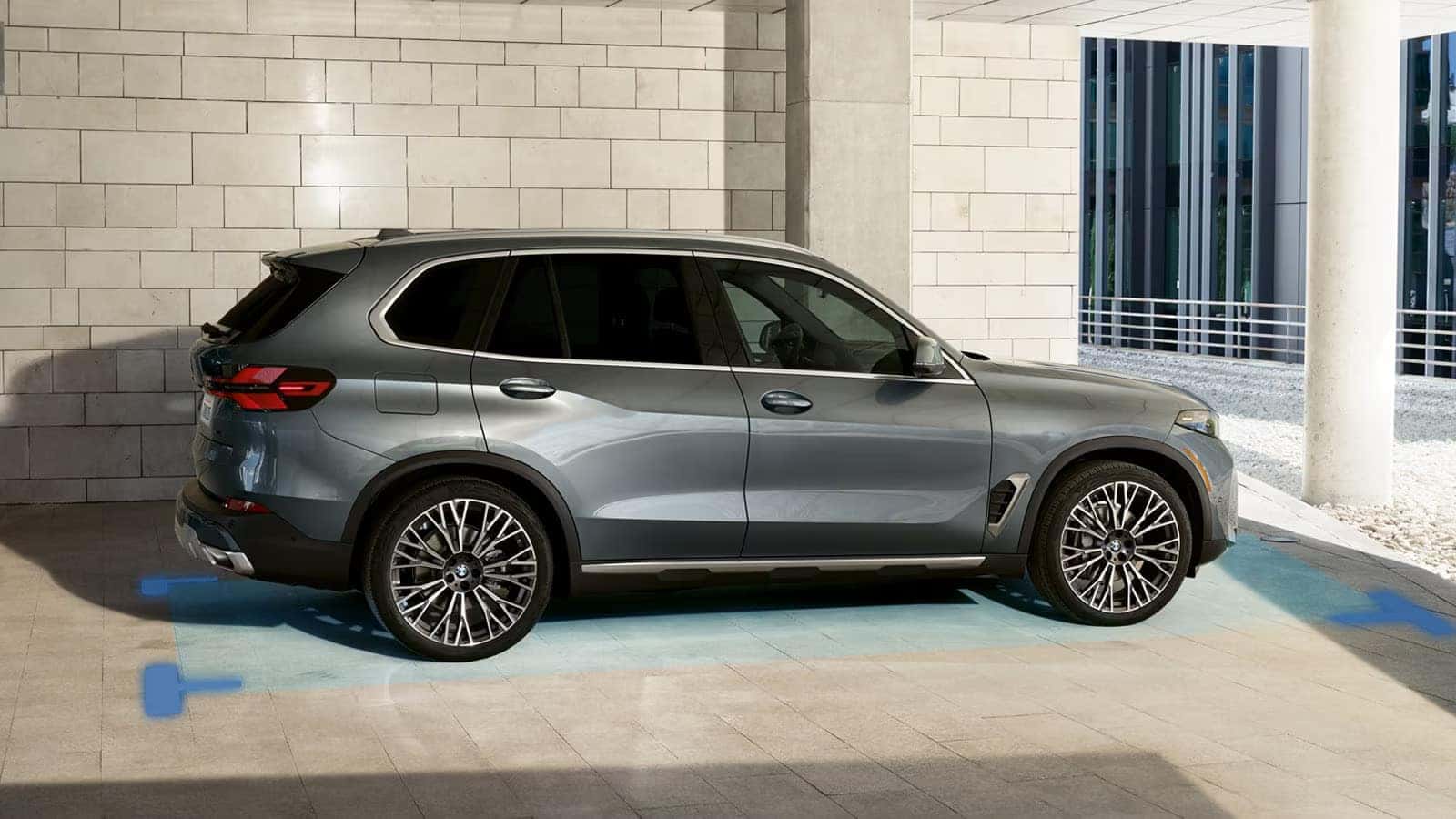 2026 BMW X5 parked in a smart parking assist zone in a modern building structure