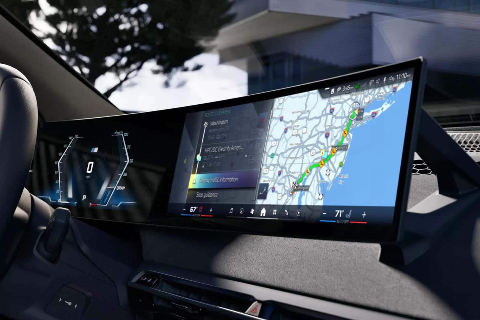 up close of the interior infotainment and digital display cluster showcasing navigation in a 2026 BMW iX