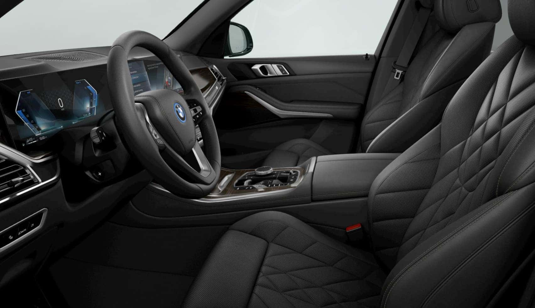 Interior view of the 2026 BMW X5 featuring black quilted leather seats, digital driver display, and modern center console