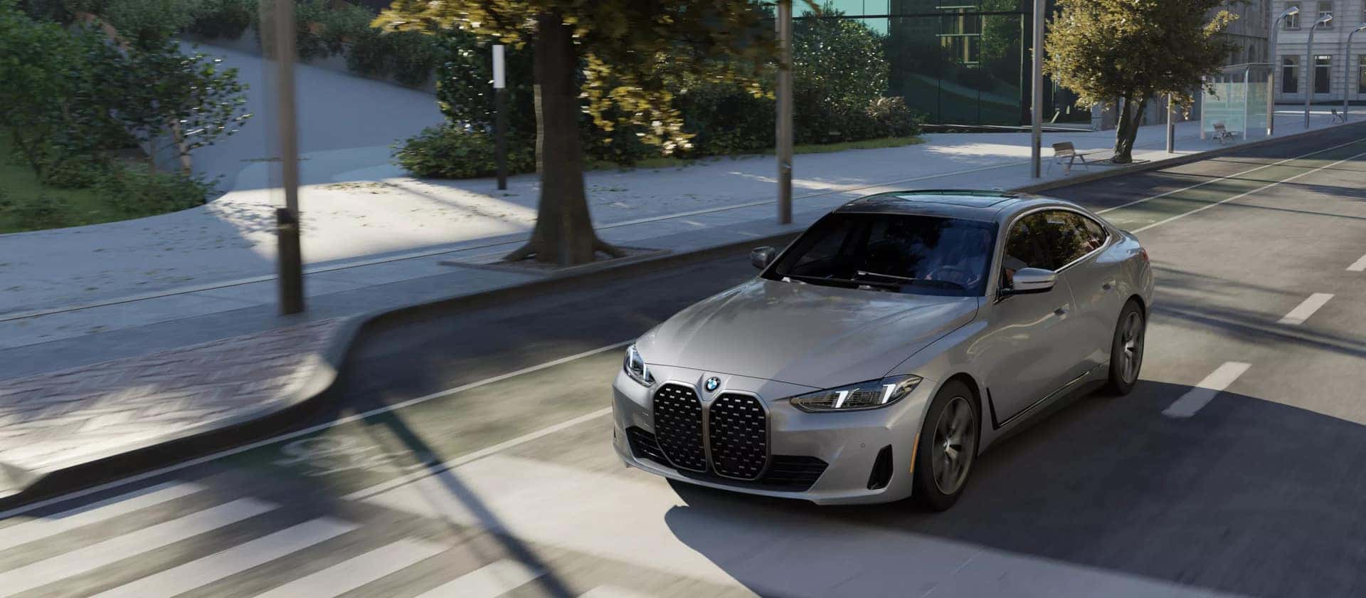 bmw 4 series gran coupe driving in the suburbs