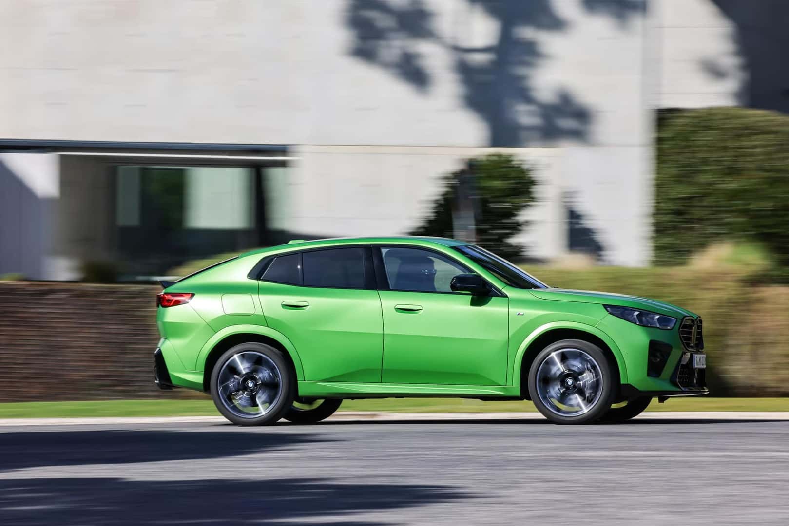 2026 bmw x2 in green driving in the city