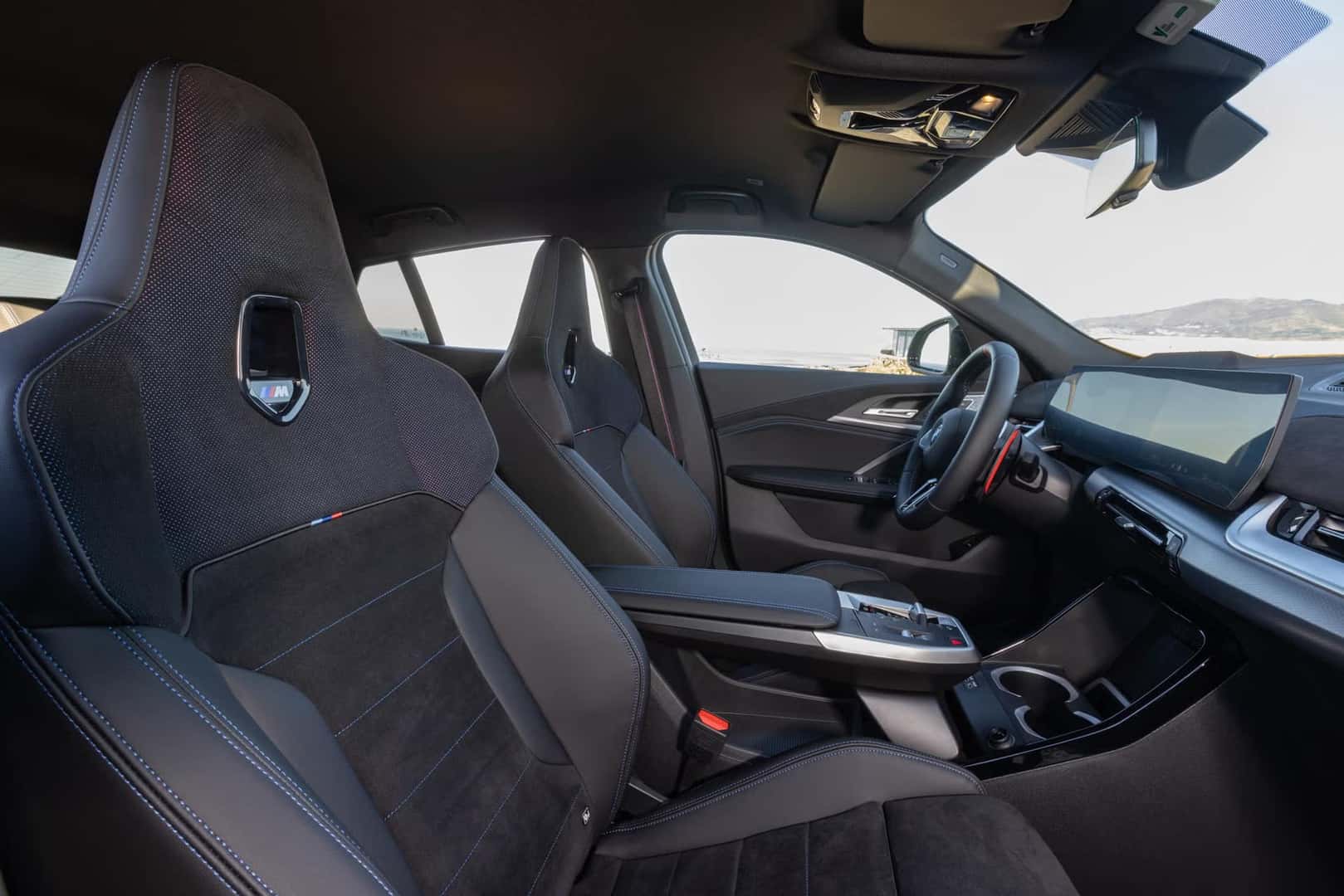 2026 BMW X2 M35i xDrive interior showing M sport bucket seats and dashboard