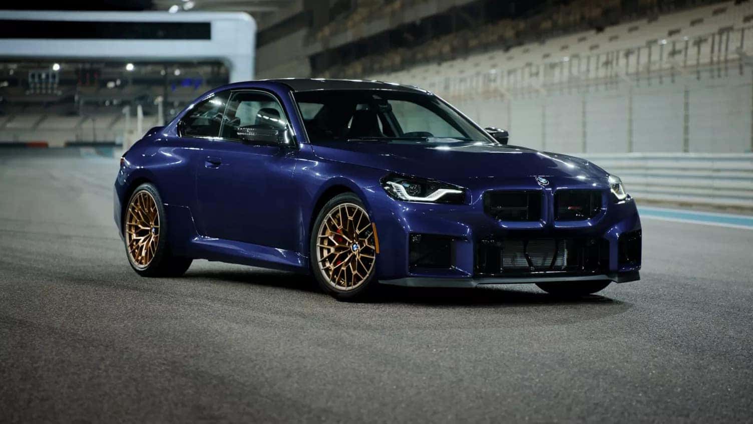 2026 BMW 2 Series parked next to a bridge