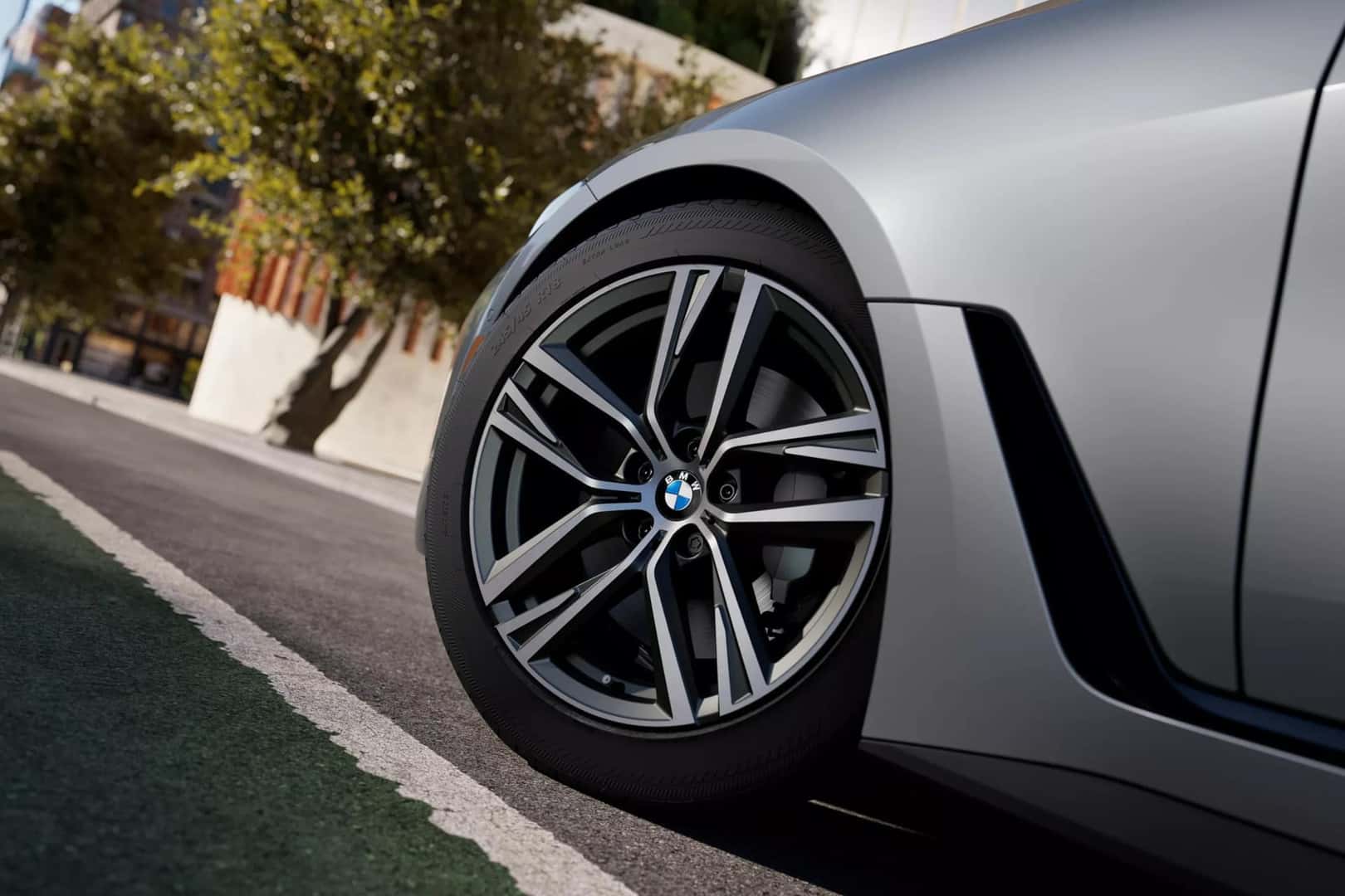 a view of the front rim and tire of the 2026 BMW 4 Series