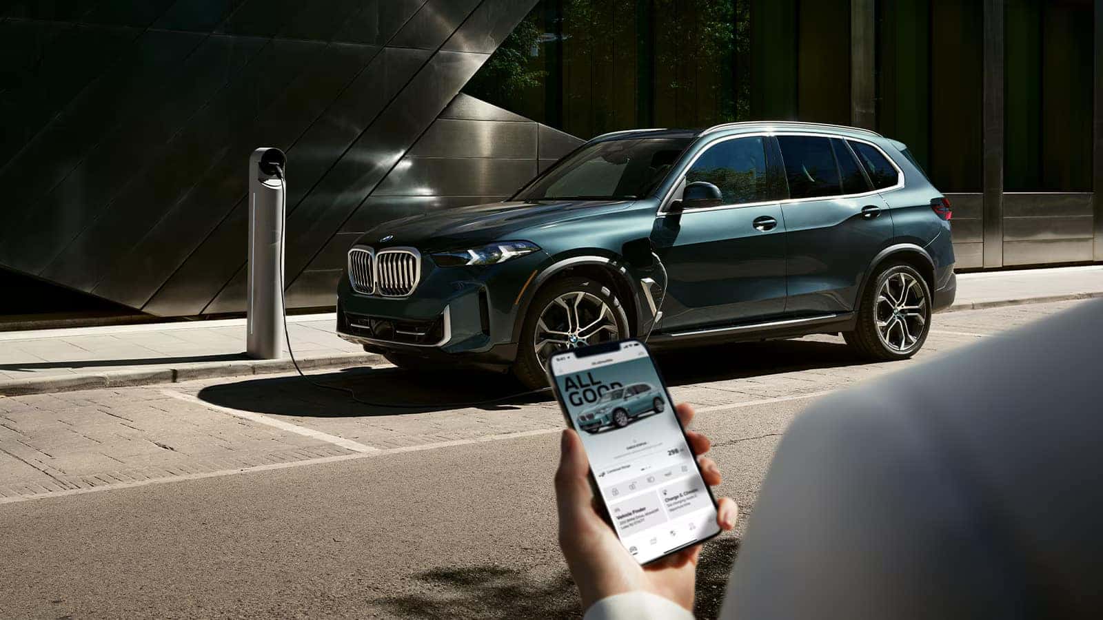 a view of a person using the BMW app for their 2026 BMW X5