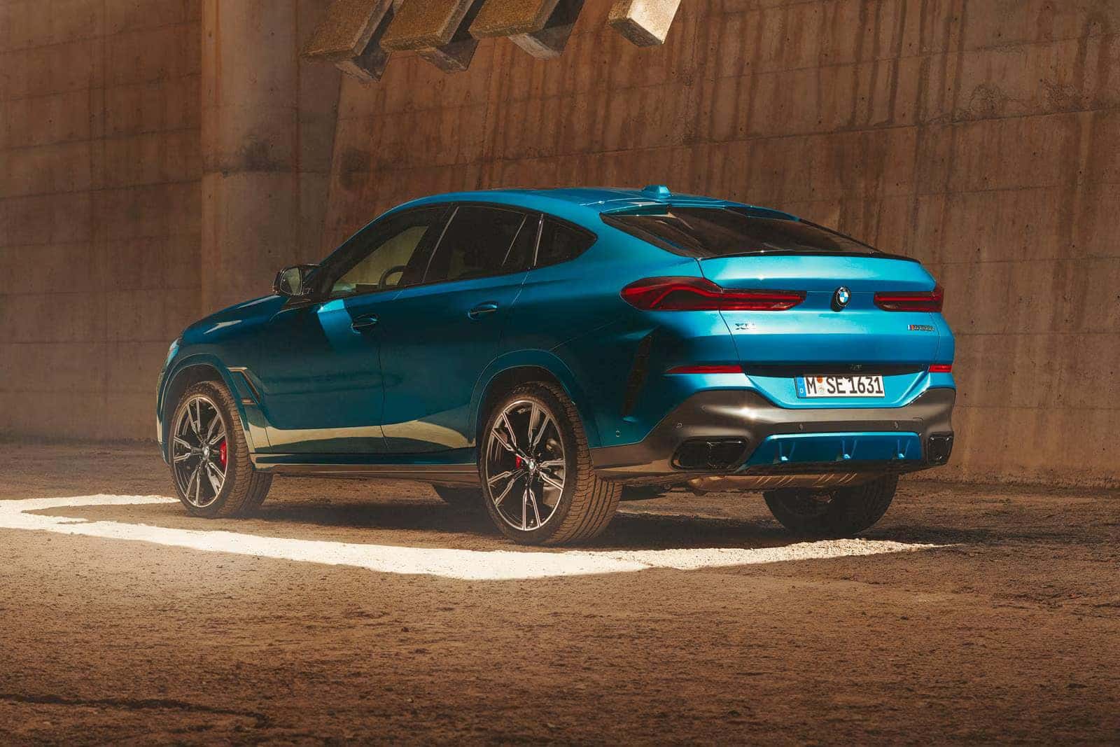 2026 BMW X6 parked on a dirt road