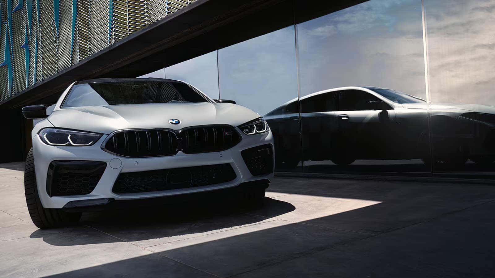 2026 BMW M8 Parked next to a building wall