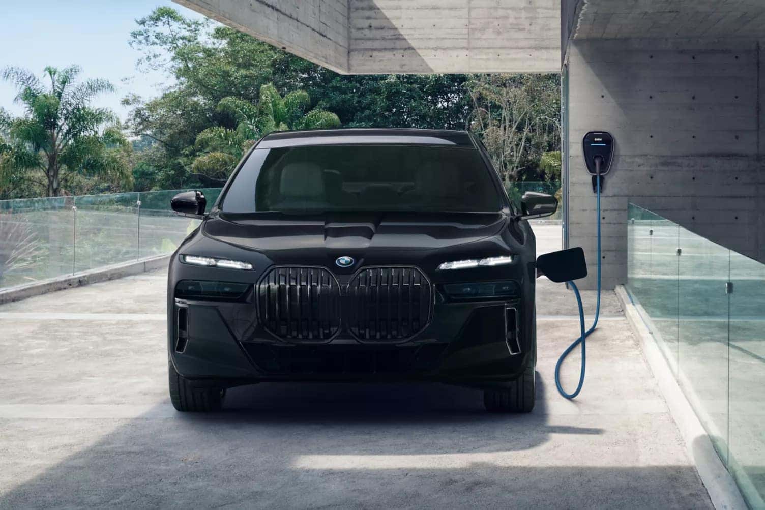 a 2026 BMW 7 Series plugged into a charger