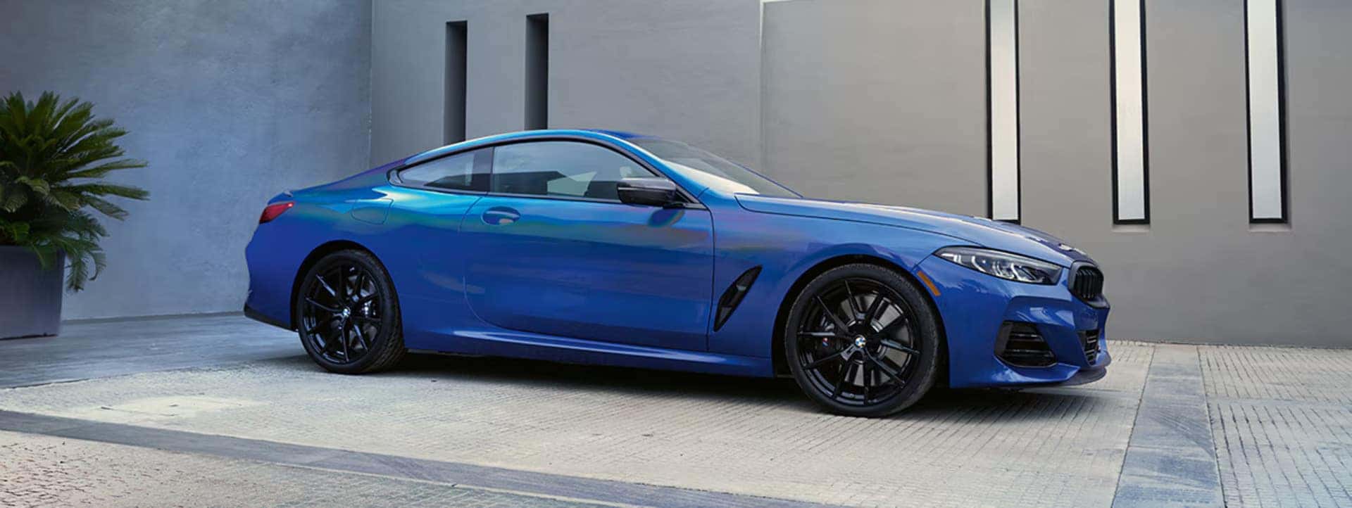 a 2026 BMW 8 Series parked at a home