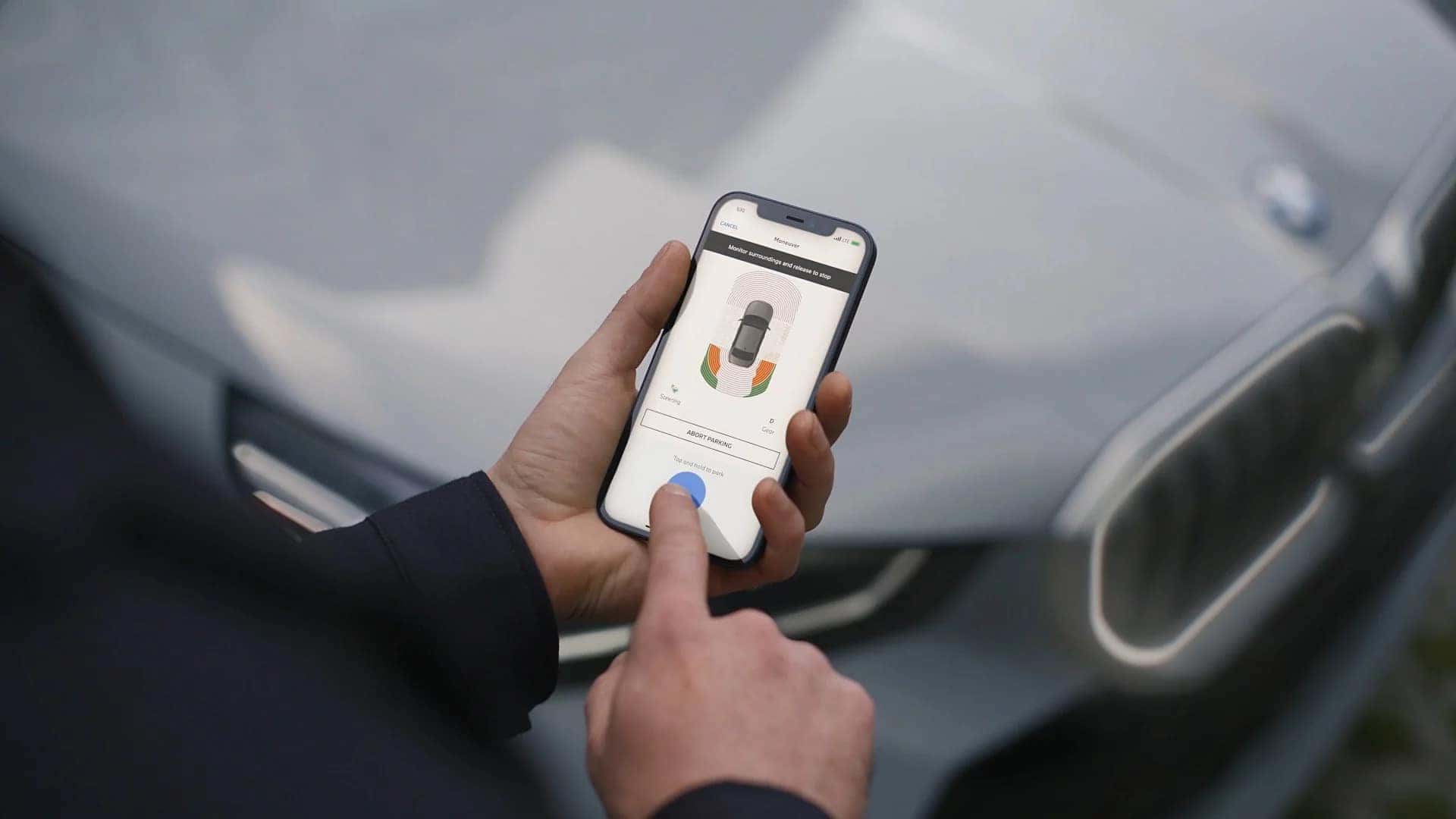 a view of a customer use the BMW app for their 2026 BMW 5 Series