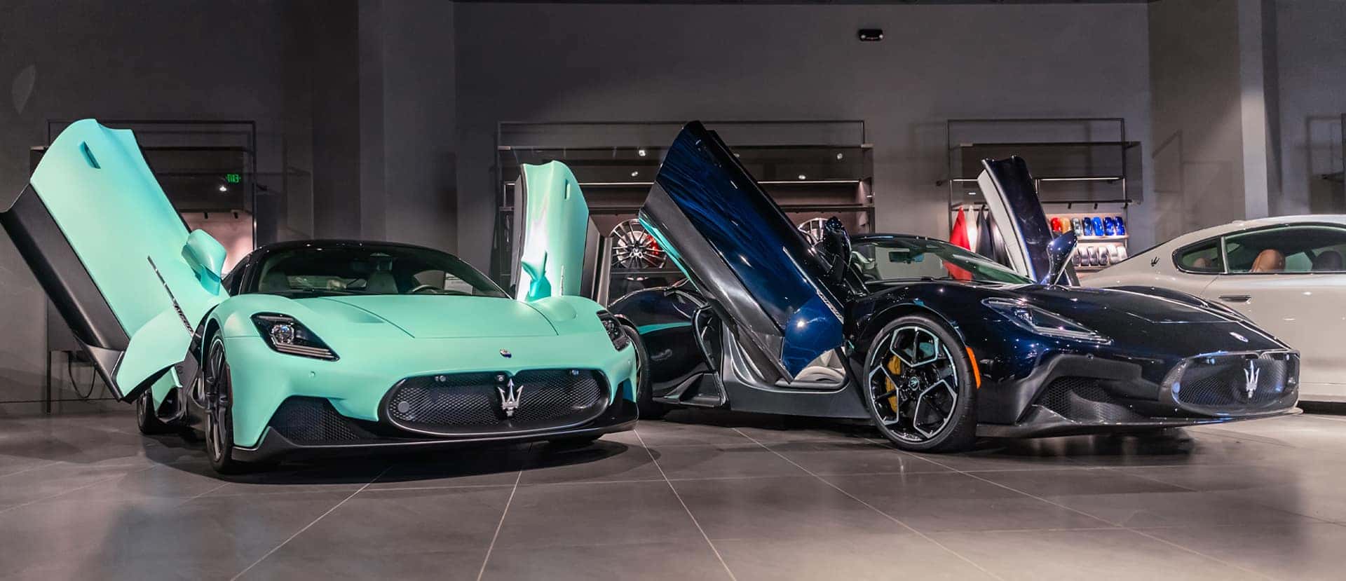 Front view of a blue 2023 Maserati Grecale parked under a bridge