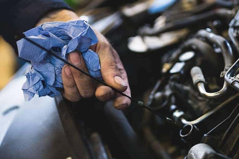 Car service mechanic working on automobile engine repair_mobile
