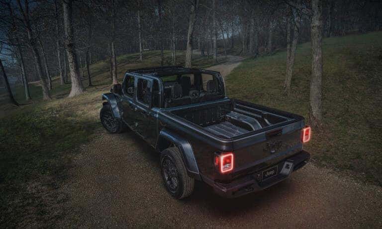 2026 Jeep Gladiator bed in a dark forest