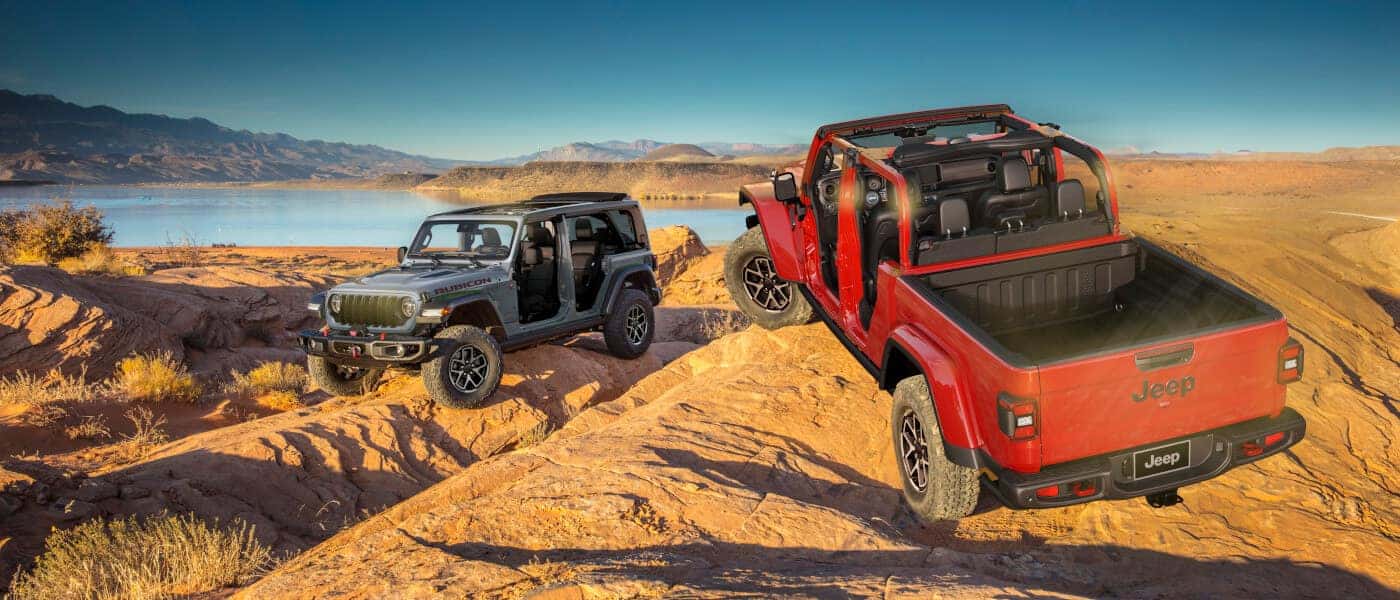 2026 Jeep Gladiator parked in desert with Wrangler