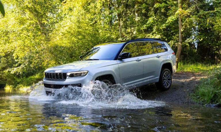 2026 Jeep Cherokee driving in a stream