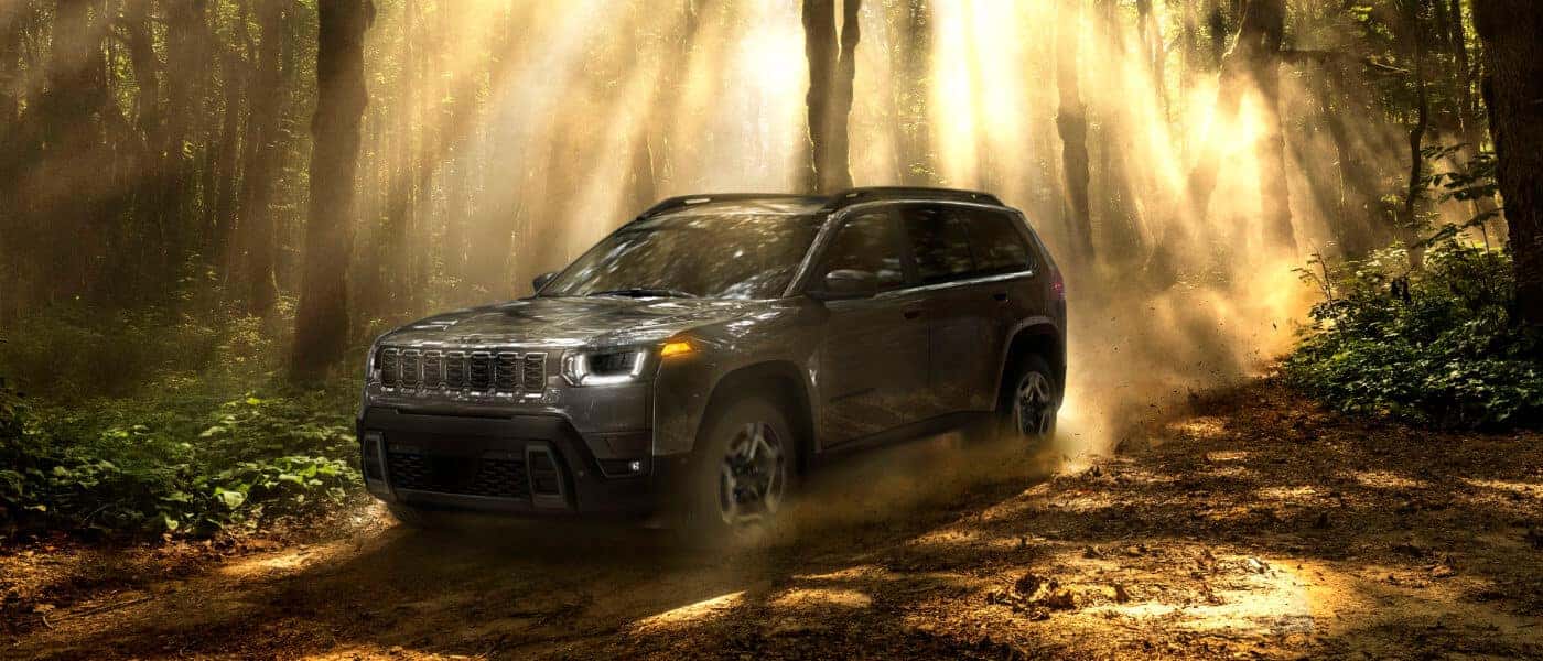 2026 Jeep Cherokee on shadowed forest trail