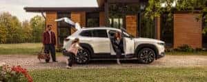 family getting out of white cx-50 hybrid