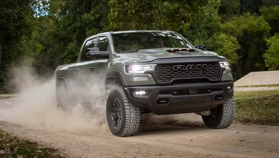 RAM truck driving on dirt road