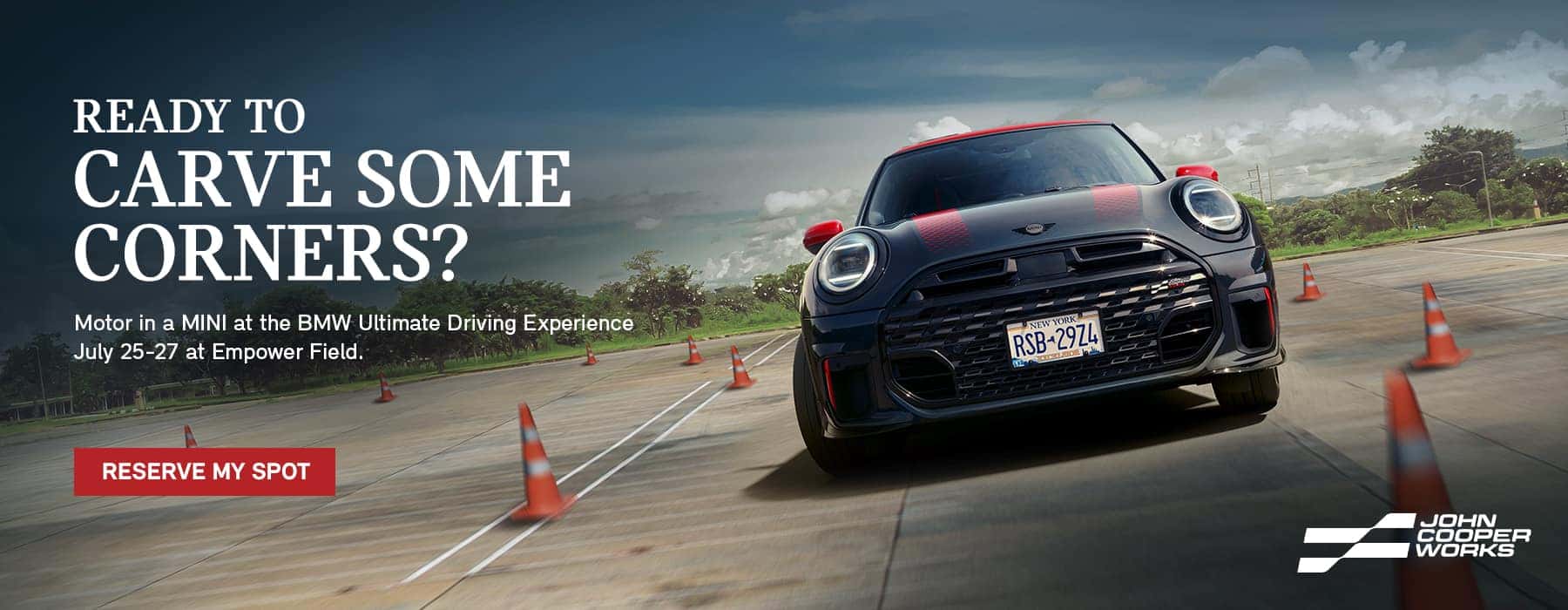 MINI JCW racing down a track.