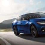 A 2021 Blue Nissan Maxima on the highway