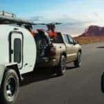 Baja Storm 2022 Nissan Frontier towing a camper