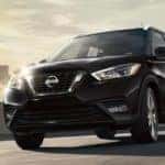 Black Nissan Kicks driving on a street