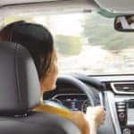 People Siting Inside Of A Nissan