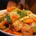 A tasty looking plate of Thai food with shrimp.