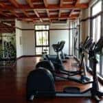 A row of exercise bikes at a gym facility