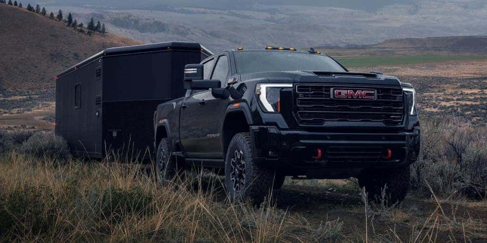 Onyx Black GMC Sierra Heavy-Duty 2025 Towing a Trailer
