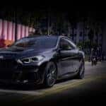 A black 2021 used BMW 2 Series Gran Coupe for sale in Roanoke driving on a street.