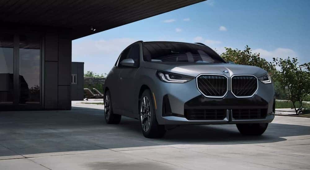 A silver 2025 BMW X3 for sale parked on a driveway.